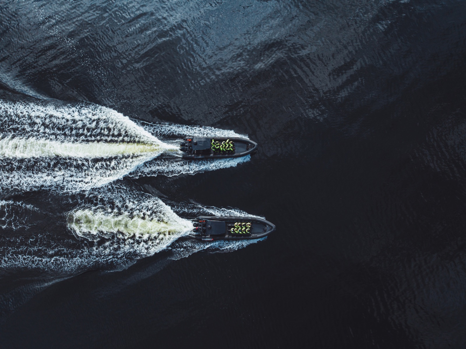 Aerial view of two Bergen Fjord Safari RIBs at speed